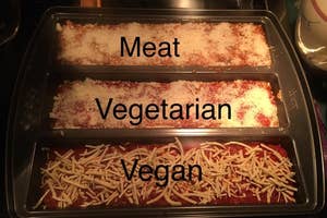 Baking pan with three sections — one with meat lasagna, one with vegetarian lasagna, and one with vegan lasagna