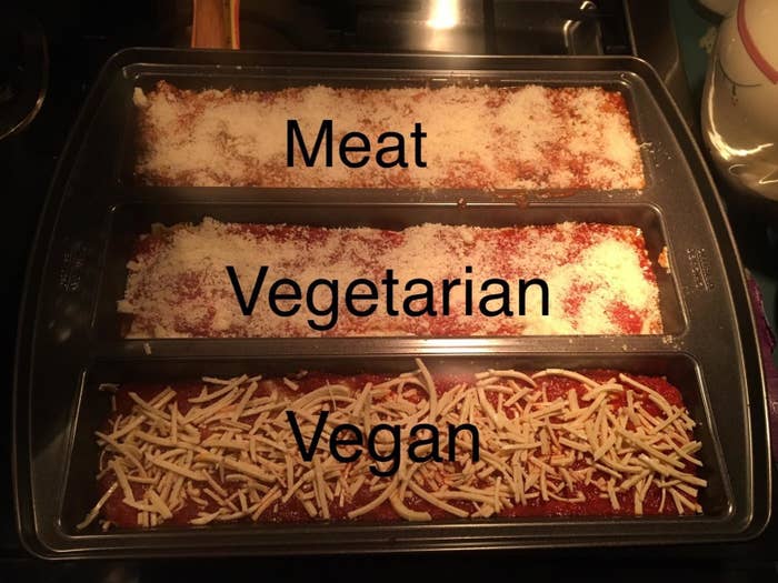Reviewer making three different kinds of lasagna in the pan: meat, vegetarian, and vegan