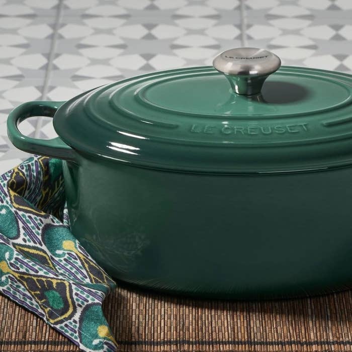 a forest green le creuset dutch oven