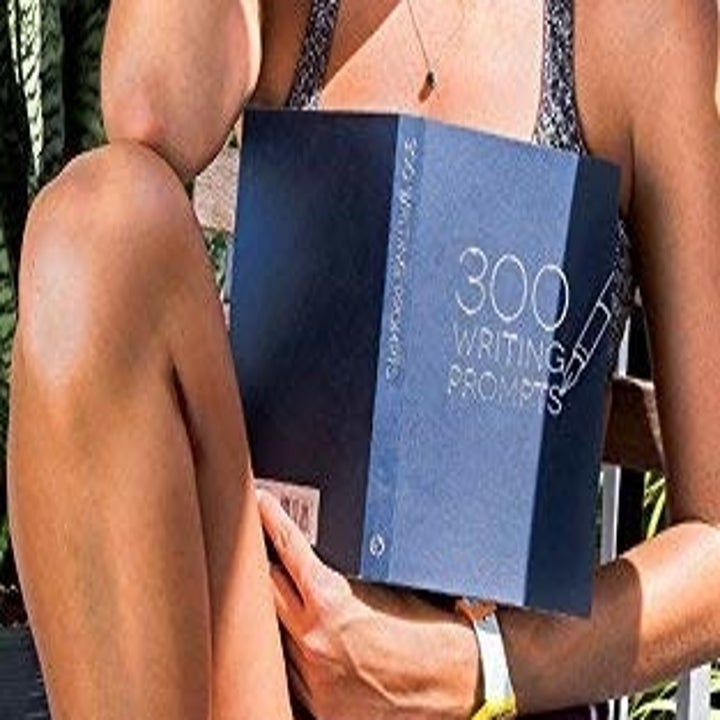 A model holding the book