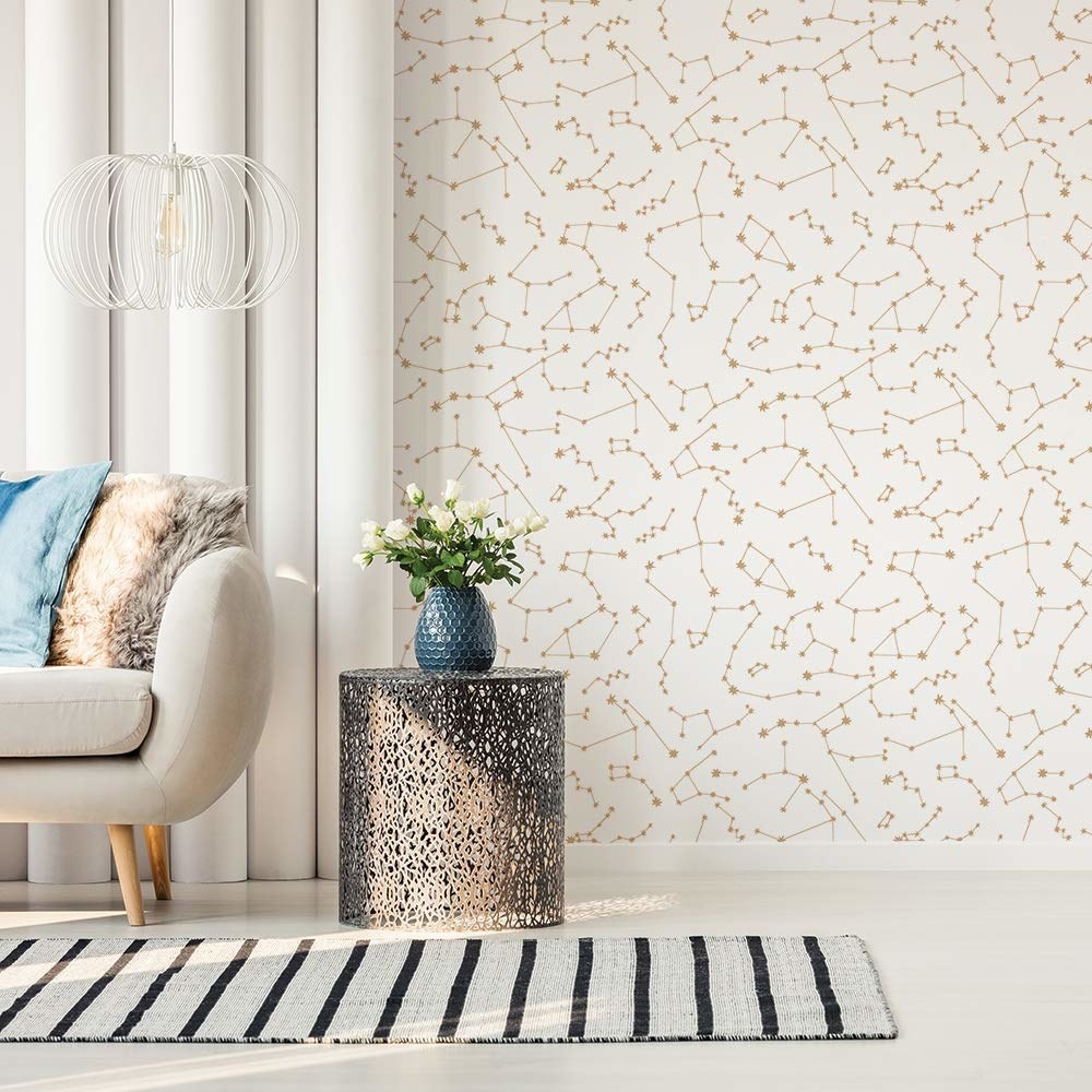 A room with floral peel and stick wallpaper