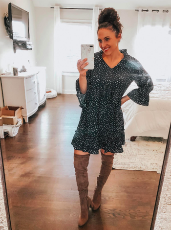 A customer review photo of the ruffled-hem dress in green