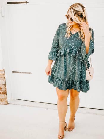 A customer review photo of the green ruffled-hem dress in size large