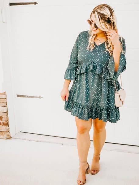 A customer review photo of the ruffled-hem dress in green