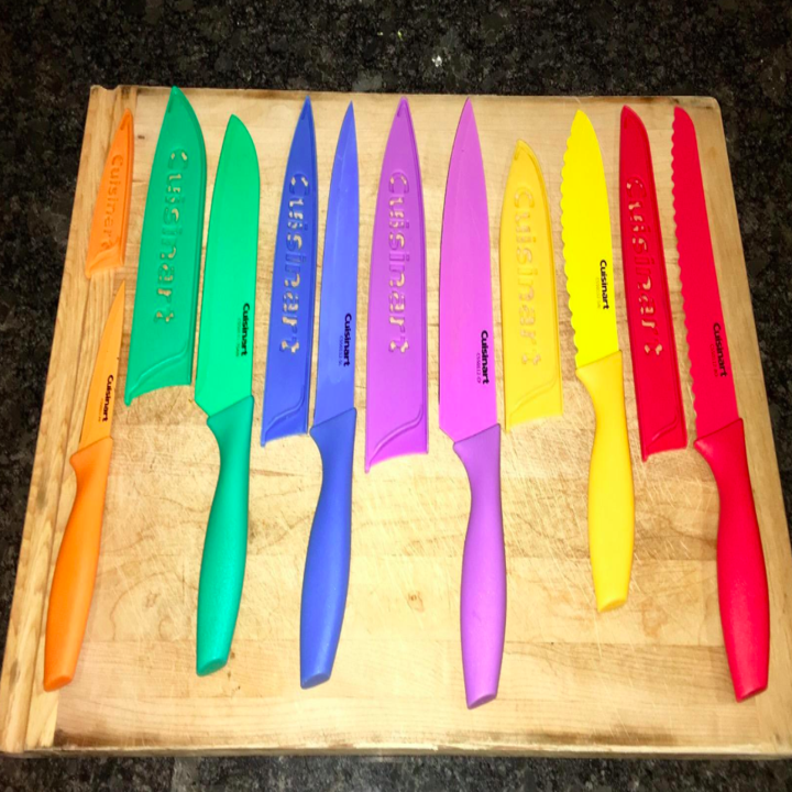the six knives laid out on a cutting board