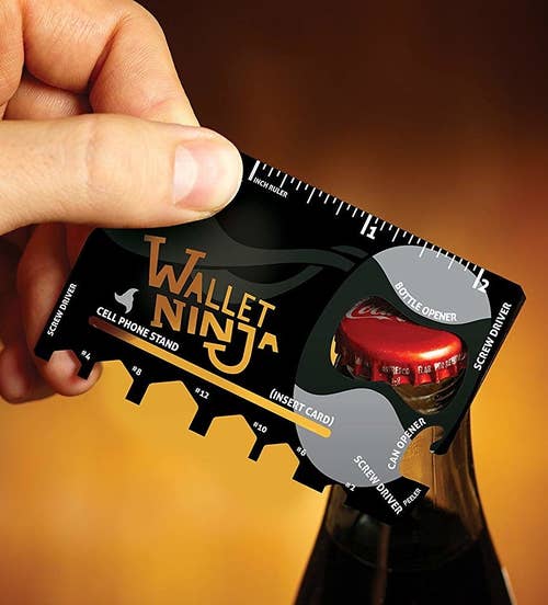the credit-card shaped tool being used as a bottle opener