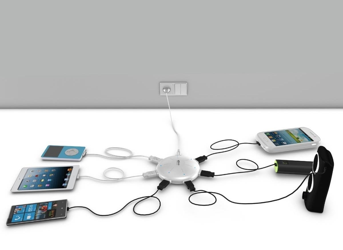 A charging station with six different devices connected to it