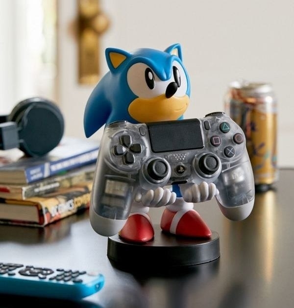 sonic the hedgehog holding a video game controller