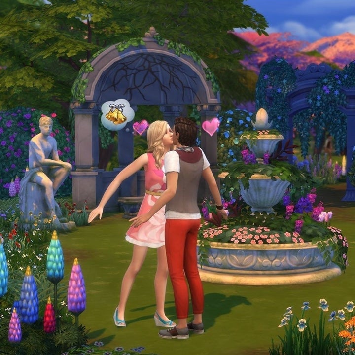 a screenshot of two sims kissing