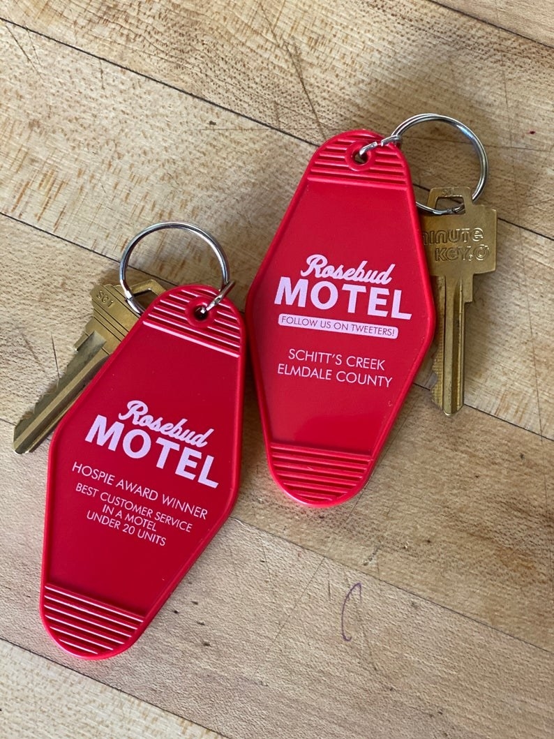 two keychains that say &quot;Rosebud motel&quot;