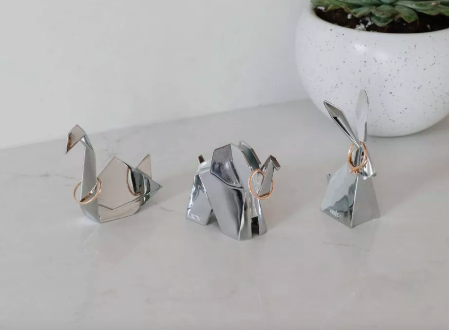 Origami animals holding jewelry