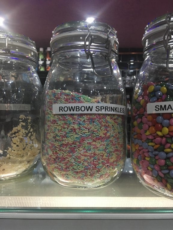 Container reading &quot;rowbow sprinkles&quot;