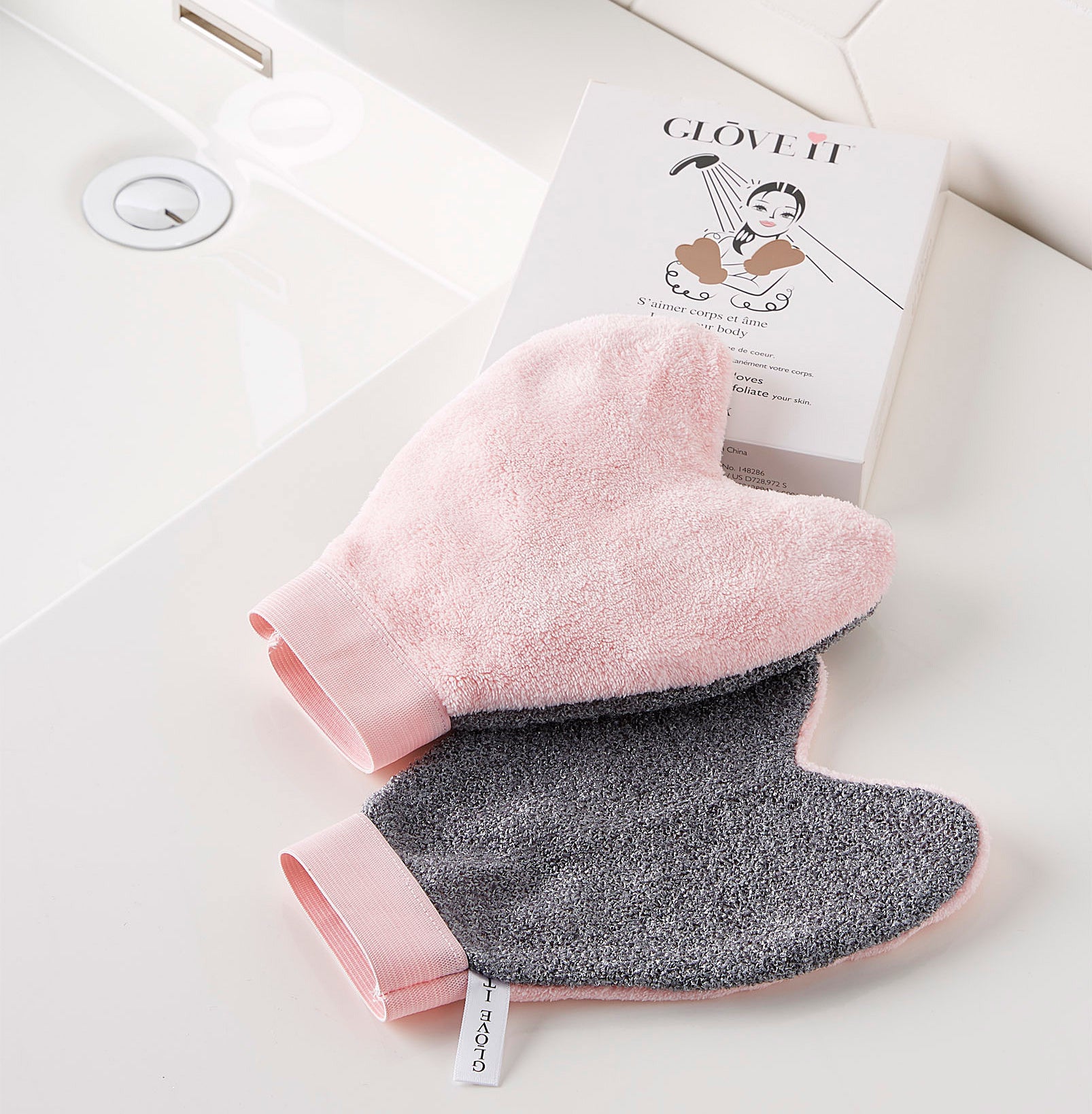 A pair of spa gloves on a bathroom counter