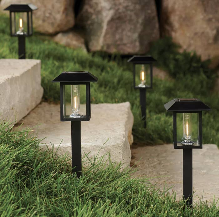 lantern lights on stakes lining a set of stairs