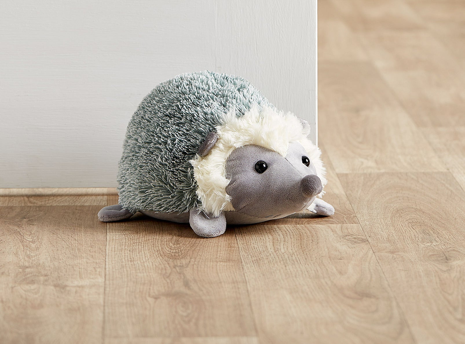 A hedgehog holds open a door