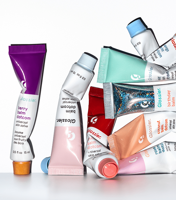 An arrangement of the Glossier Balm Dotcom tubes in eight different formulas