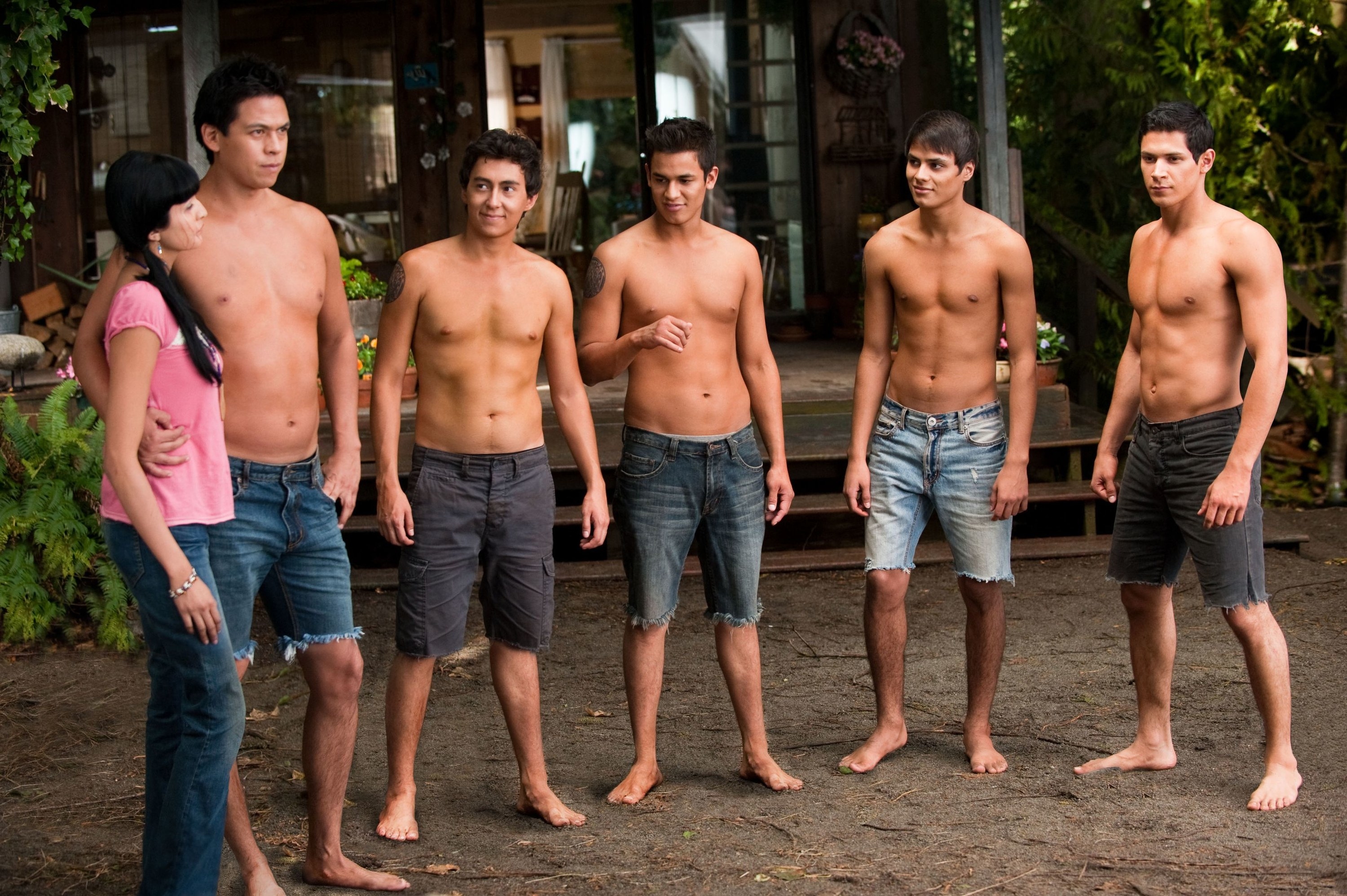 The shirtless wolf pack standing with Emily