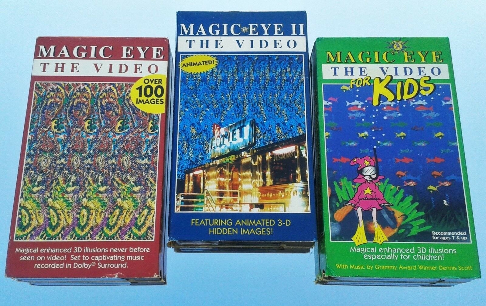 Three different Magic Eye VHS tapes on a blue background