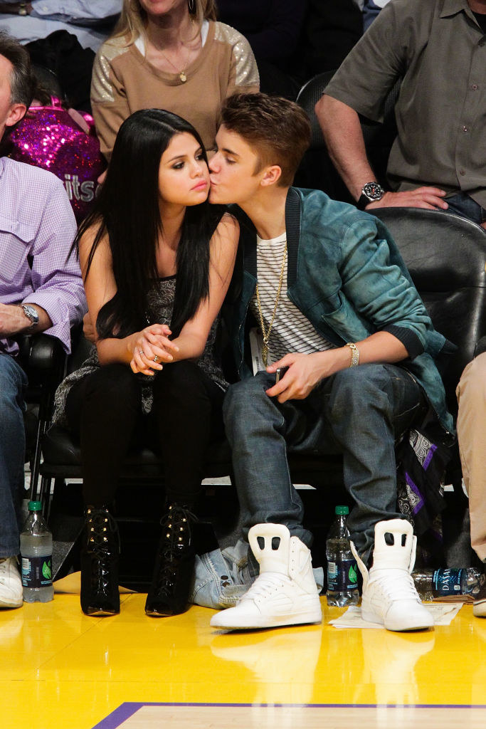 with Justin Bieber at a basketball game