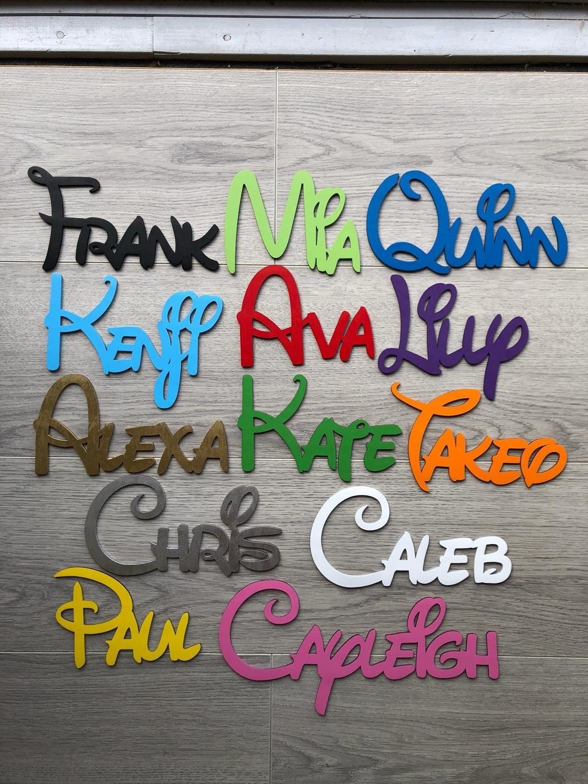A variety of names spelled out using the Disney font in a variety of color.