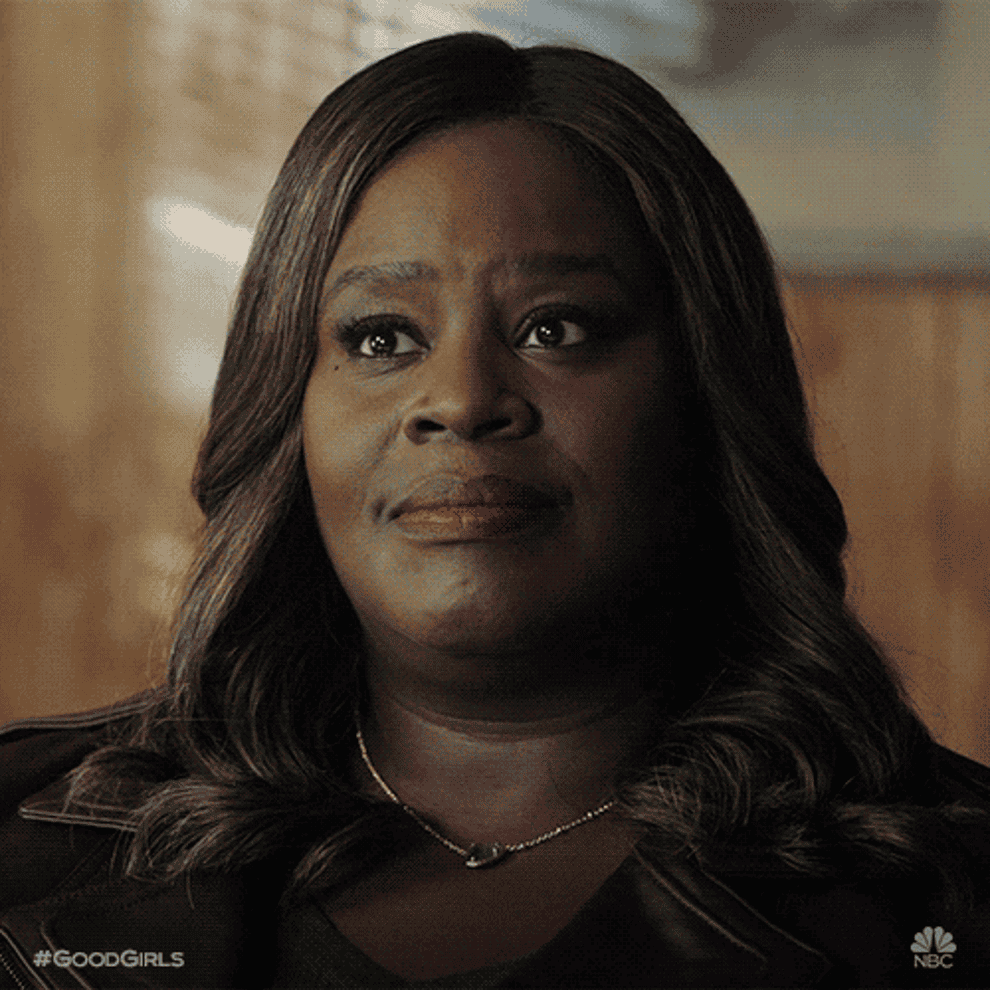 Gif of Retta from Good Girls looking convinced 