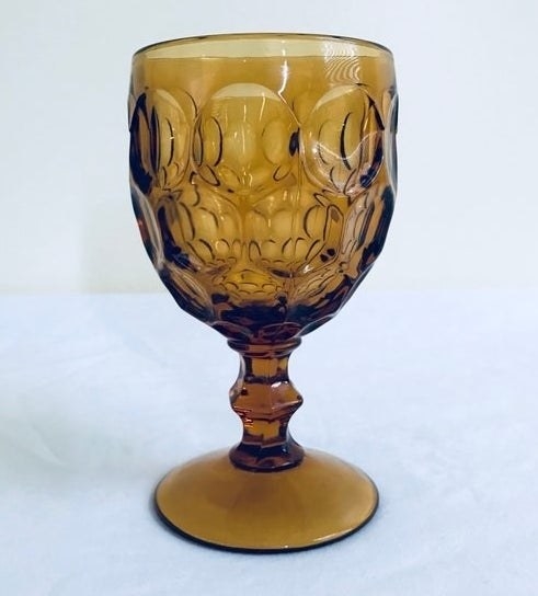 Vintage amber ornate wine goblet