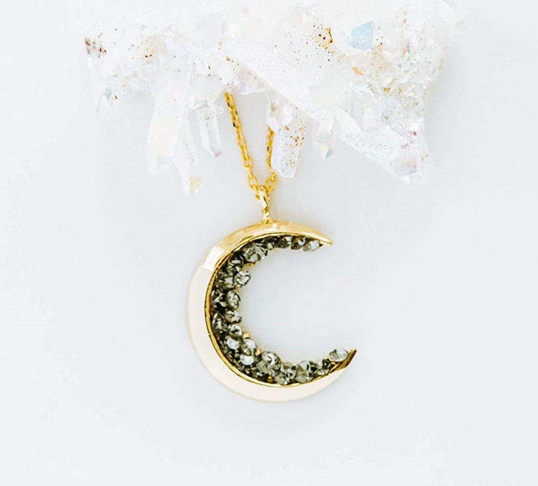 gold crescent pendant necklace with rhinestone details