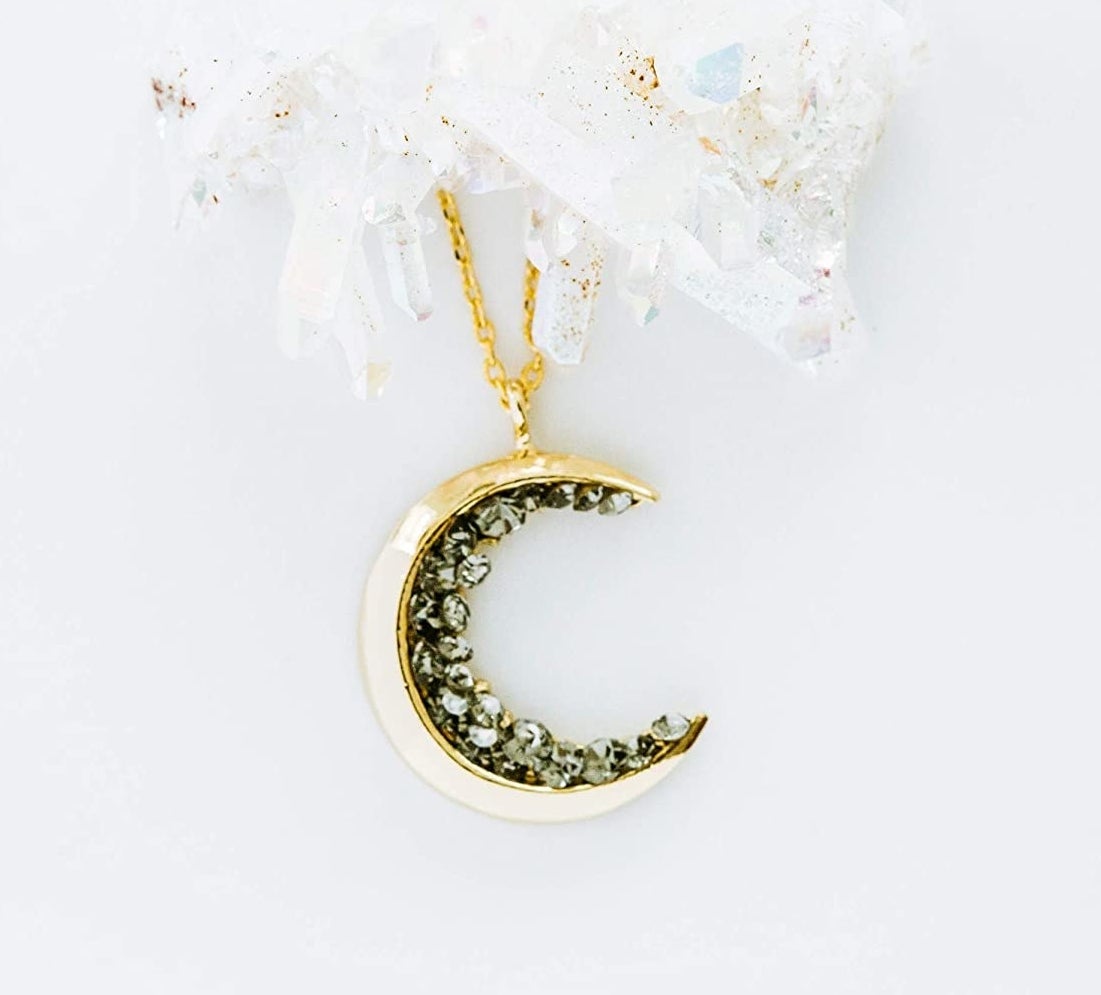 gold crescent pendant necklace with rhinestone details
