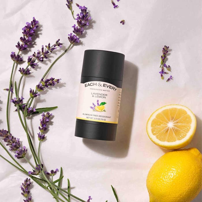 the deodorant stick with lavender and lemons around it 