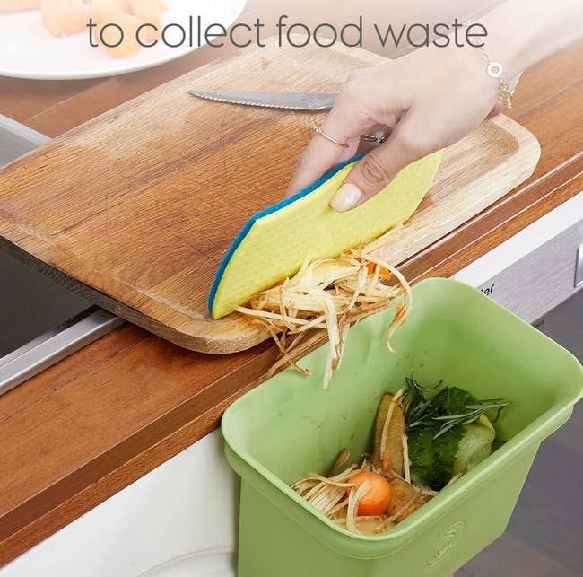 the green bin attached to a kitchen countertop 