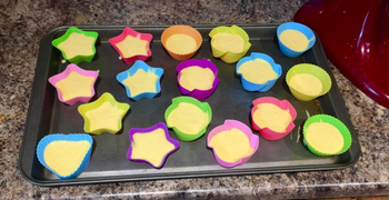 batter in baking cups before being baked