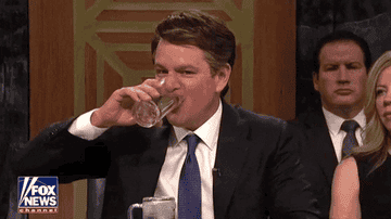gif of Matt Damon chugging a glass of water on the TV show &quot;SNL&quot;