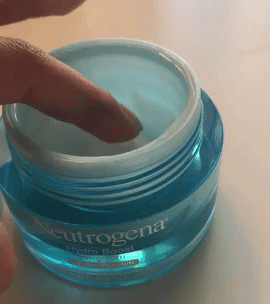 A gif of a hand dipping into the jar of Neutrogena Hydro Boost cream and pulling out a small dab of it