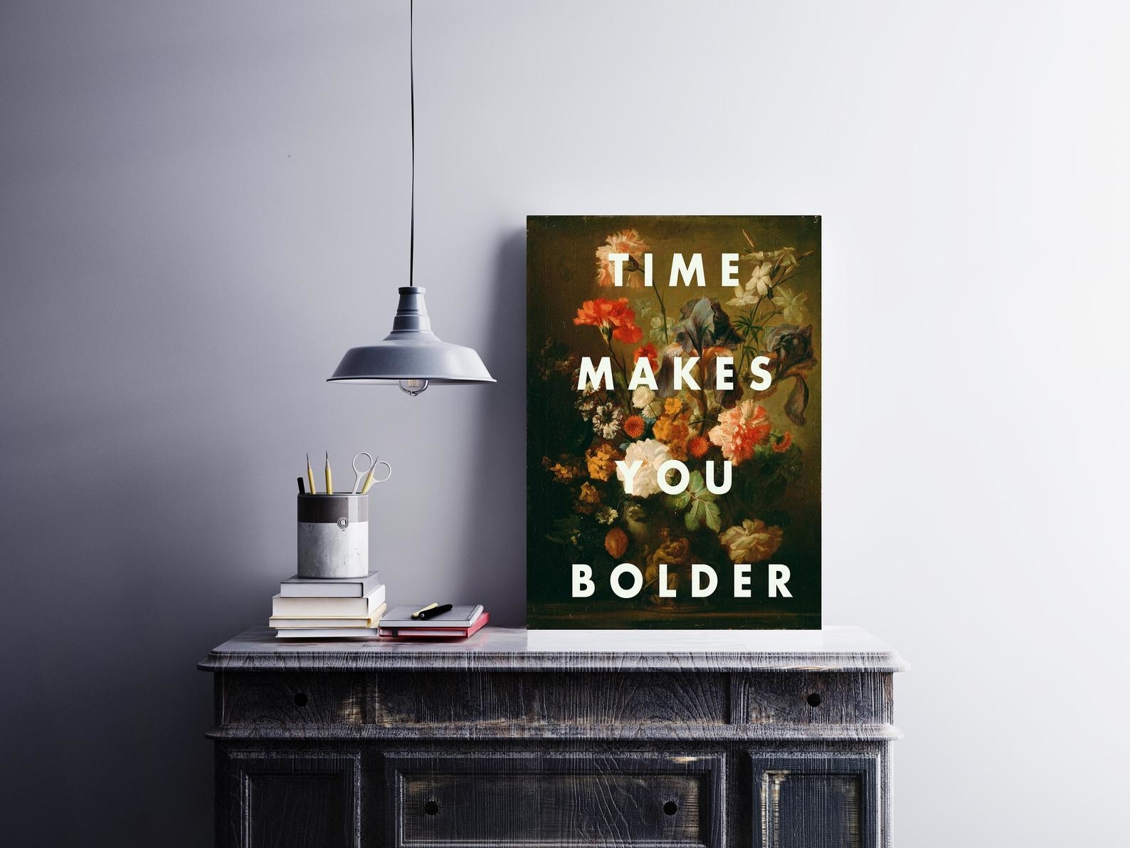 print with florals and text "time makes you bolder"