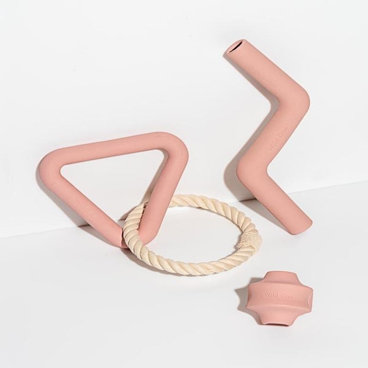 Product photo showing the Wild One 3-piece chew toy set in blush 