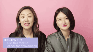 the two beauty experts illustrating pinching the skin on your hand to test out if your skin is dehydrated