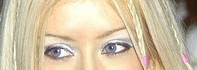 Crop of Christina Aguilera&#x27;s eye with her wearing frosty blue eyeshadow