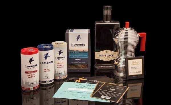 cans of loa colombe lattes, a coffee maker, a bottle of liquor, and more