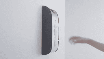 A GIF of a person pulling a plastic bag out of a wall mounted bag dispenser