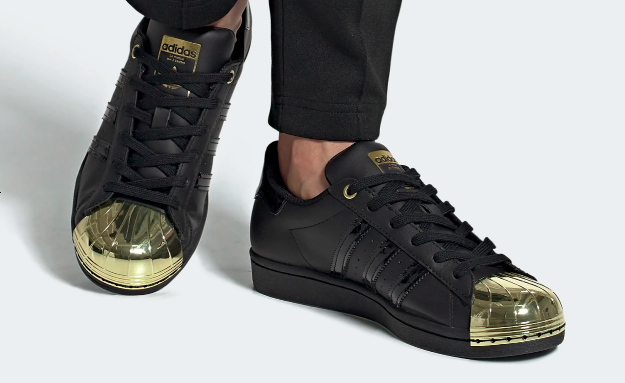 Black shoes with a golden toe cap 