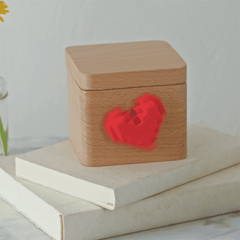 Gif of the small wooden box with a heart in the front spinning