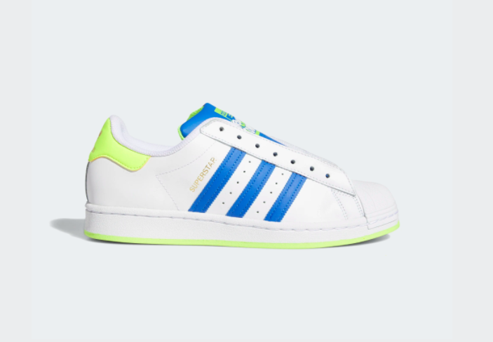 A shoe with a white base and bright blue classic adidas stripes down the side with a vibrant lime green sole and heel  