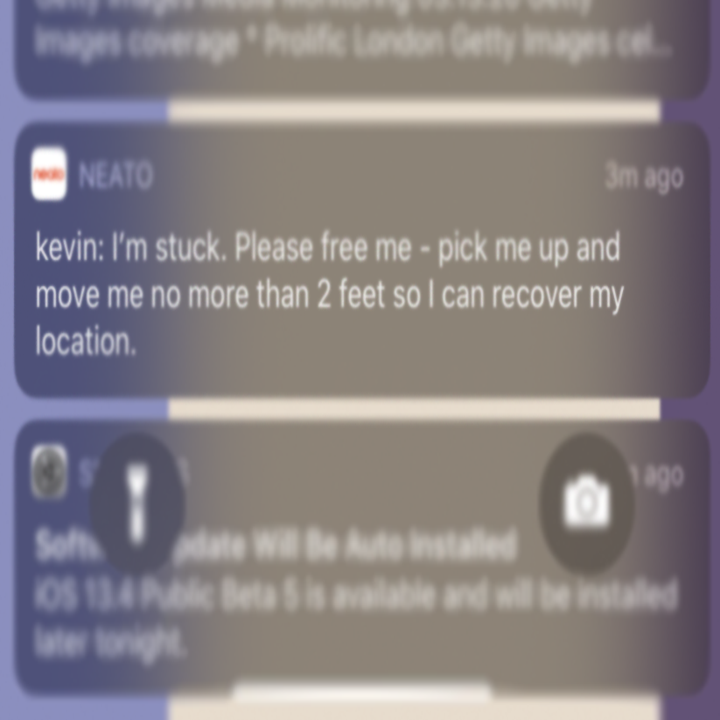 a screenshot of the vacuum messaging a phone saying "I'm stuck, please free me"