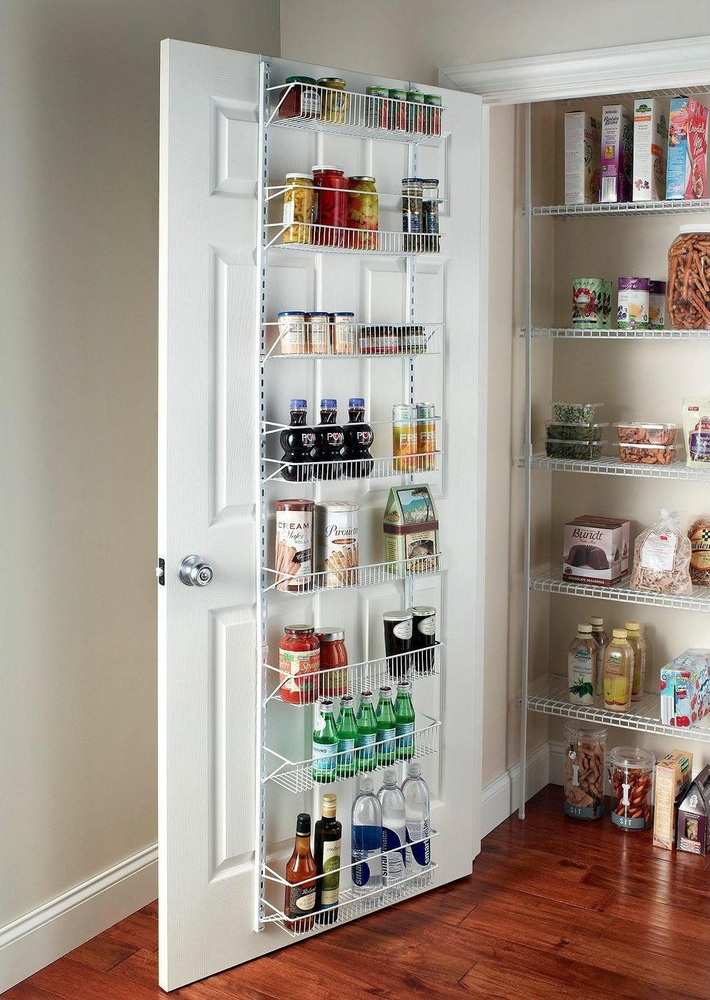 A white over the door rack in a pantry with eight shelves full of food and bottles 