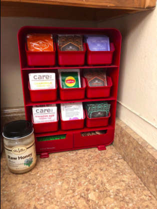 vertical organizer on counter with different tea bags in each compartment