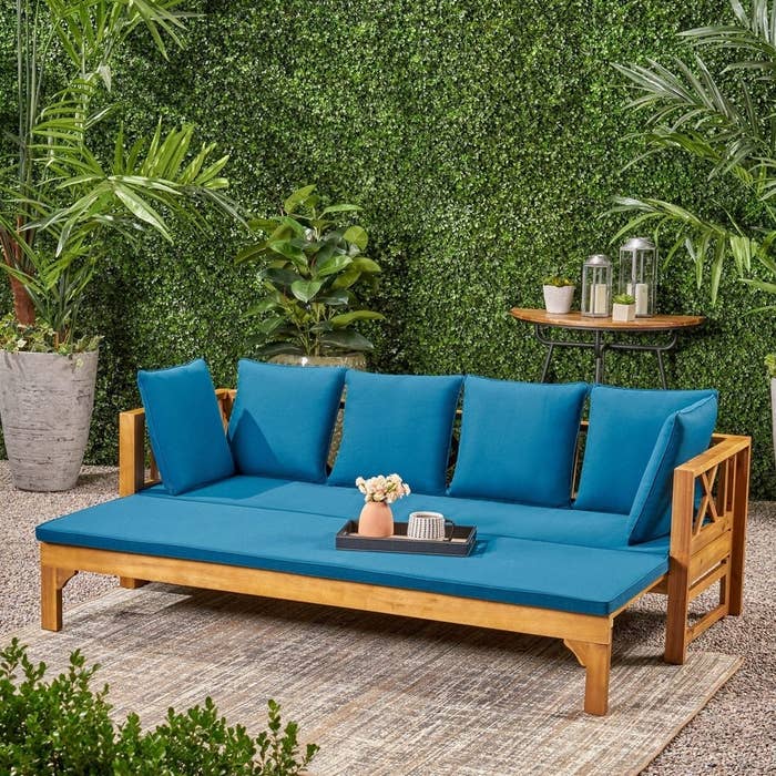 Outdoor daybed with dark blue cushions