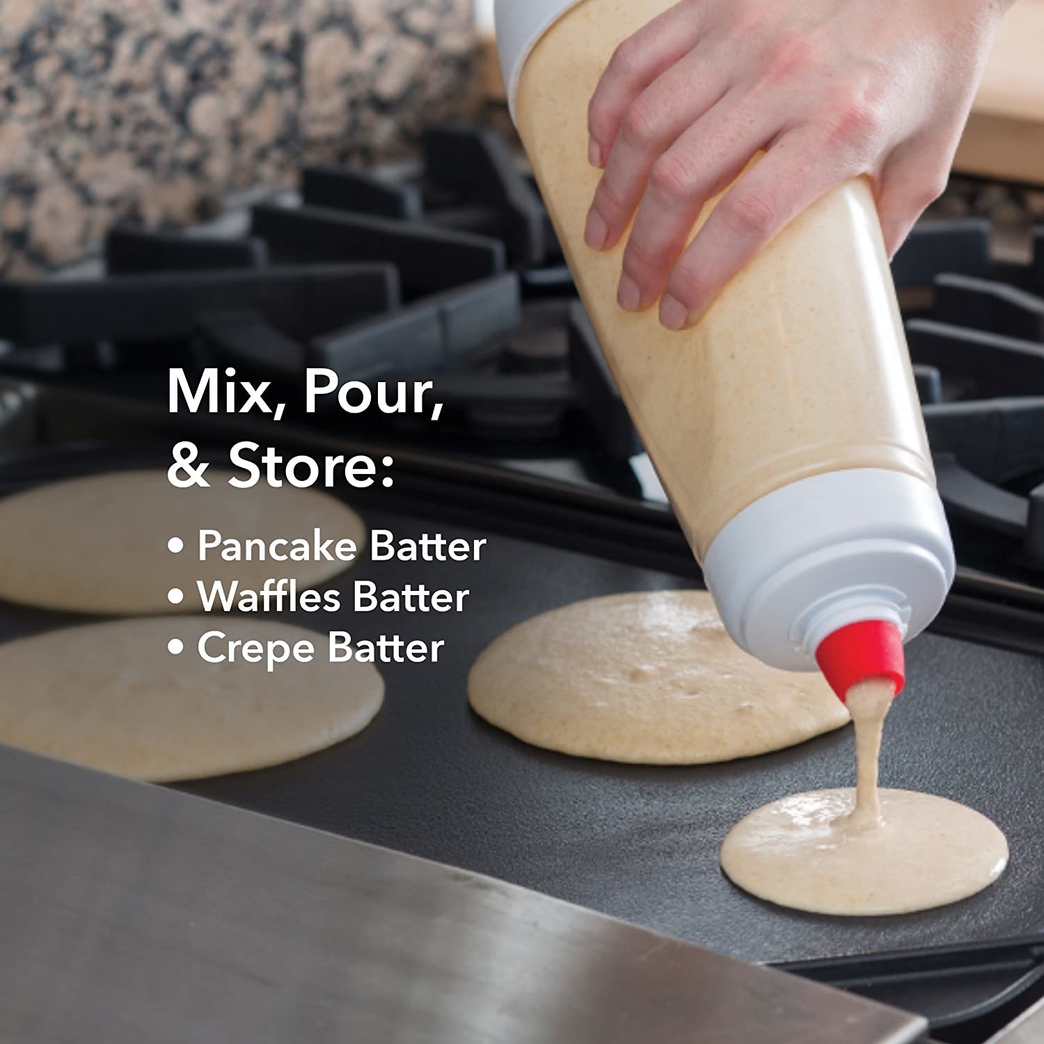 A clear plastic pancake mixer pouring batter onto a hot grill from its red silicone spout