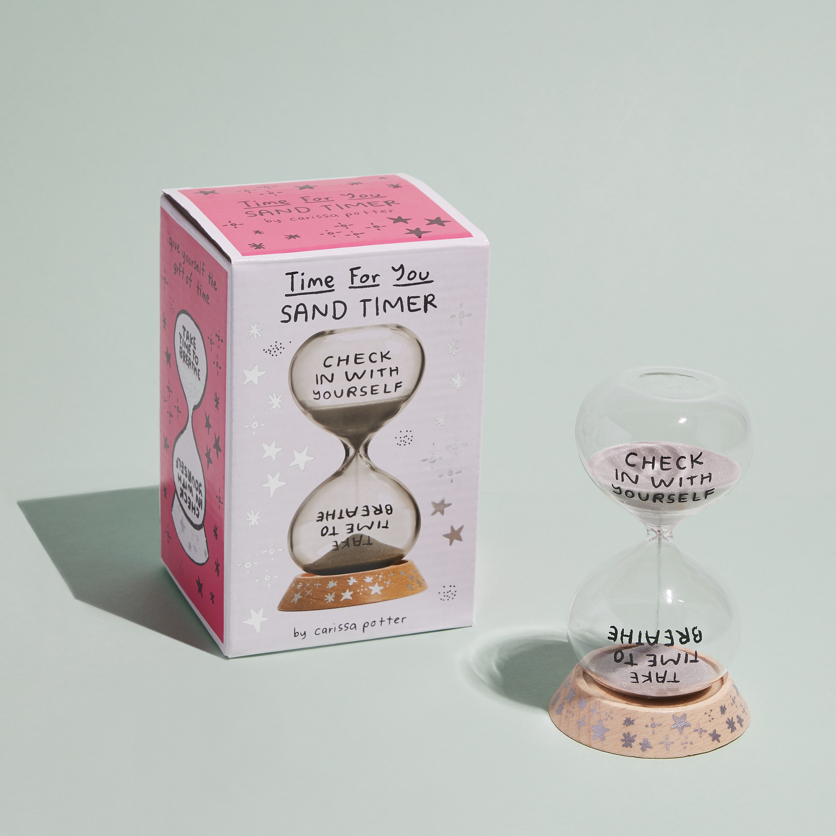 a small glass timer that says &quot;check in with yourself&quot; on one side and &quot;take time to breathe&quot; on the other