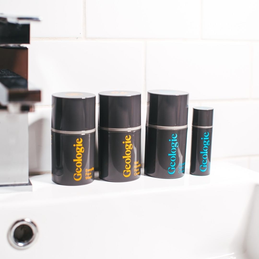 Four Geologie skincare bottles on the sink