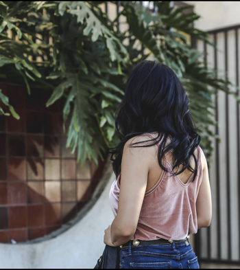 Reviewer turned around to show the dipped V in the neckline at the back 